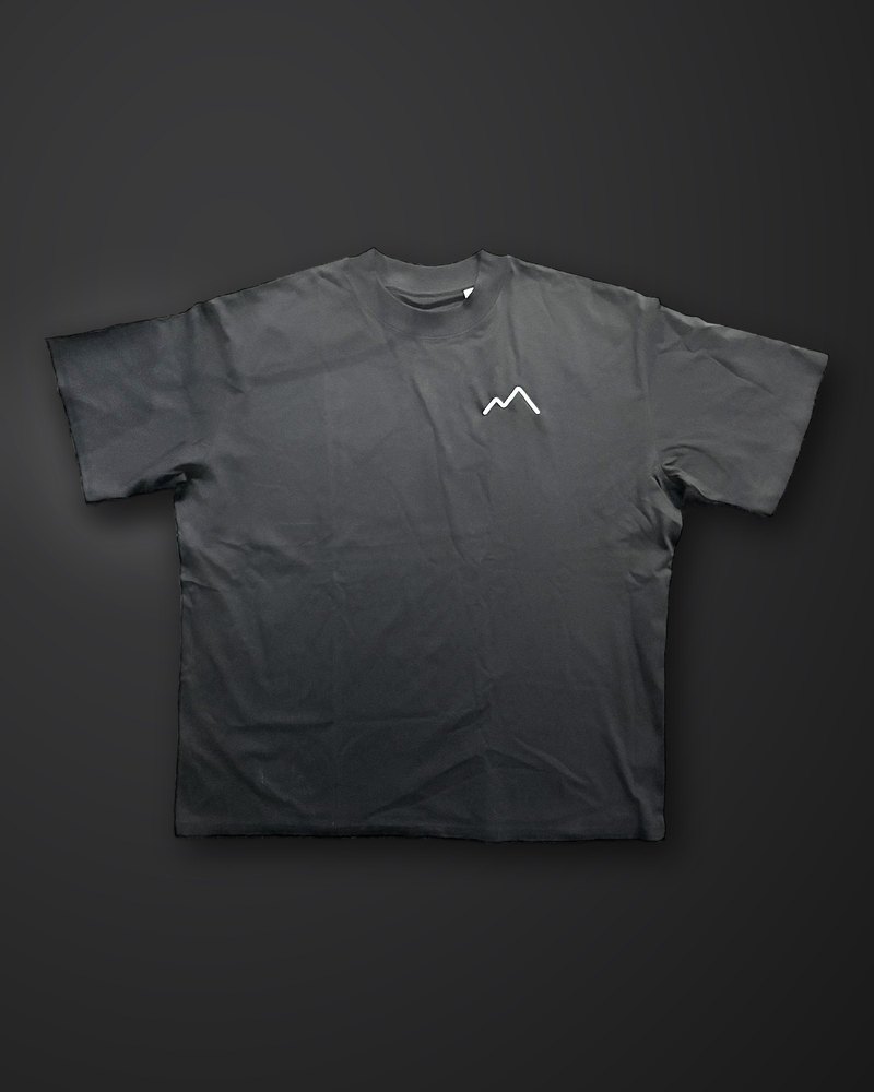 The Tee in black, embroidered ridge on the chest